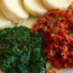 Ugali + spinach + fried eggs with sauce