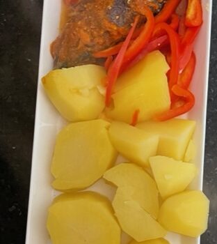 Steamed potatoes and grilled mackerel fish in sauce